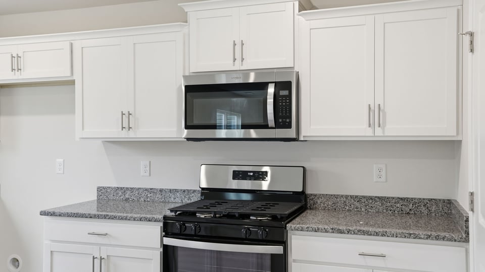 Kitchen with island and countertops.
