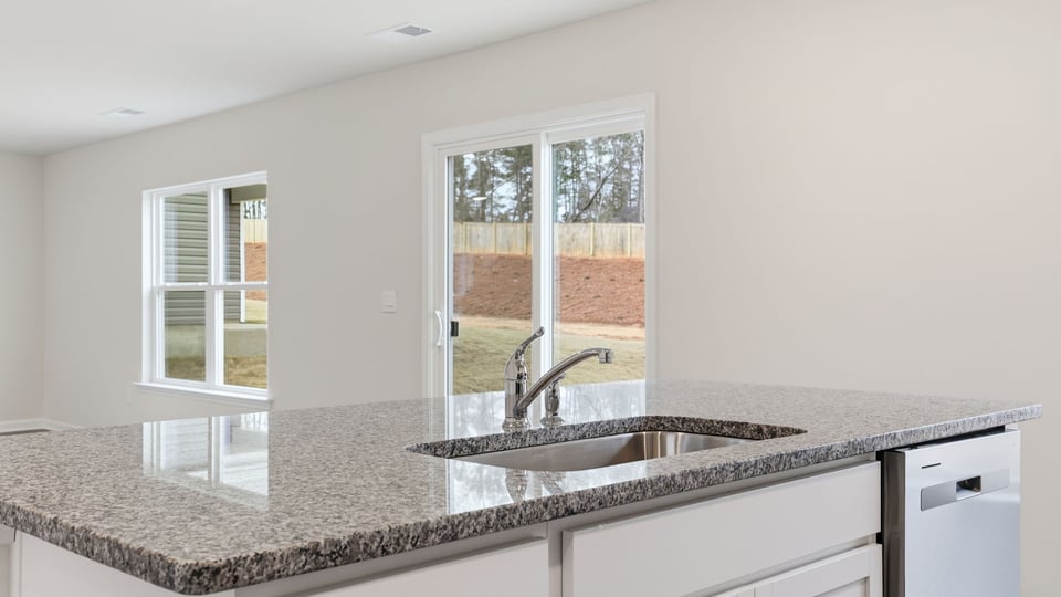 Kitchen with island and countertops.