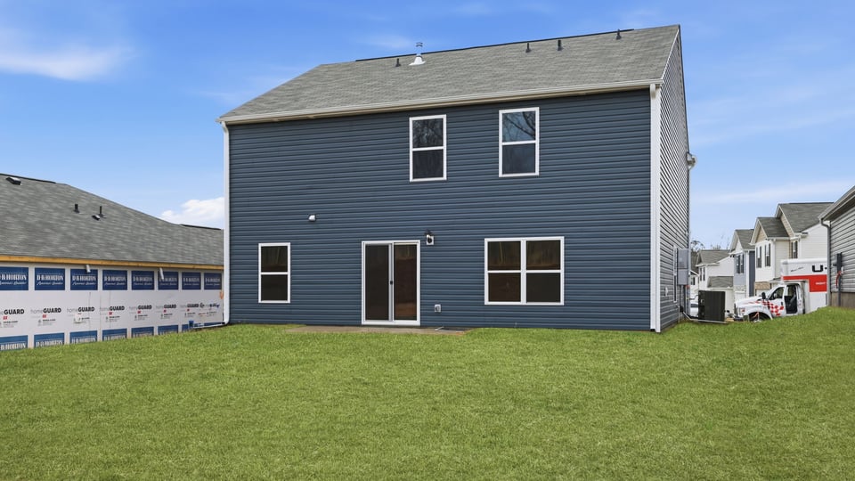 Exterior home with large backyard.
