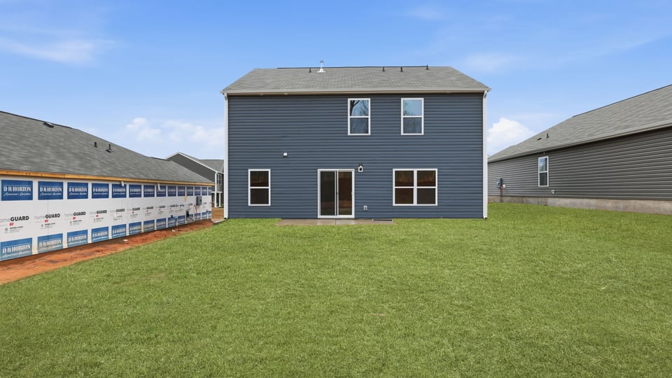 Exterior home with large backyard.