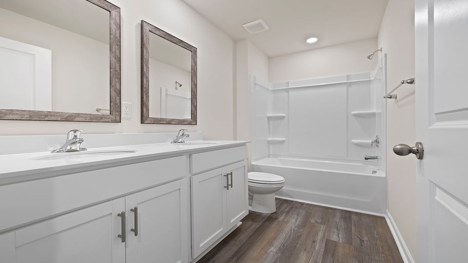 Bathroom with vanity and tub.