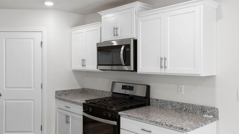 Kitchen area with stainless-steel appliances.