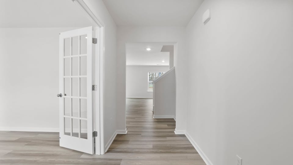 View of flex room with French doors.