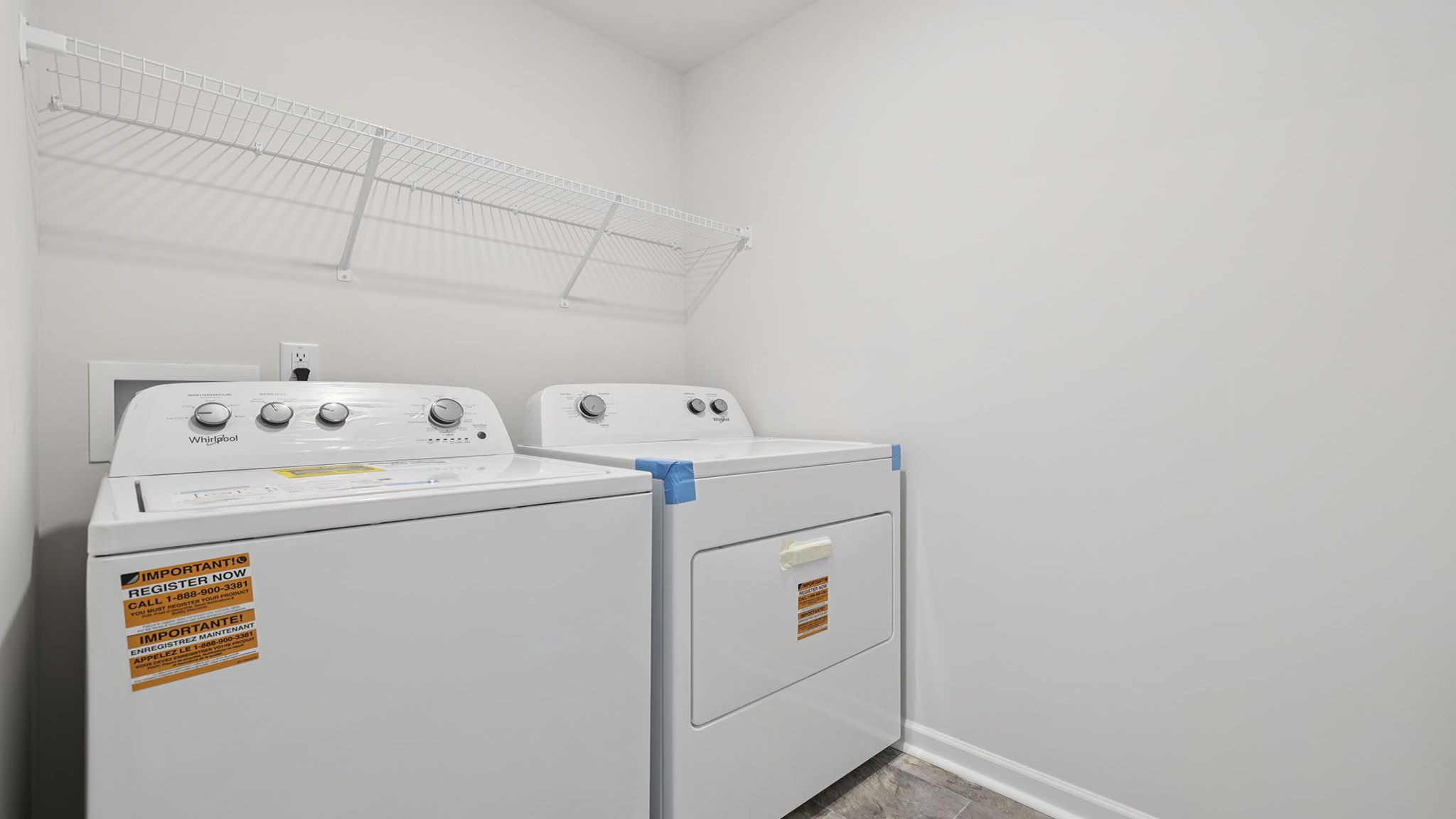 Walk in laundry with shelves.