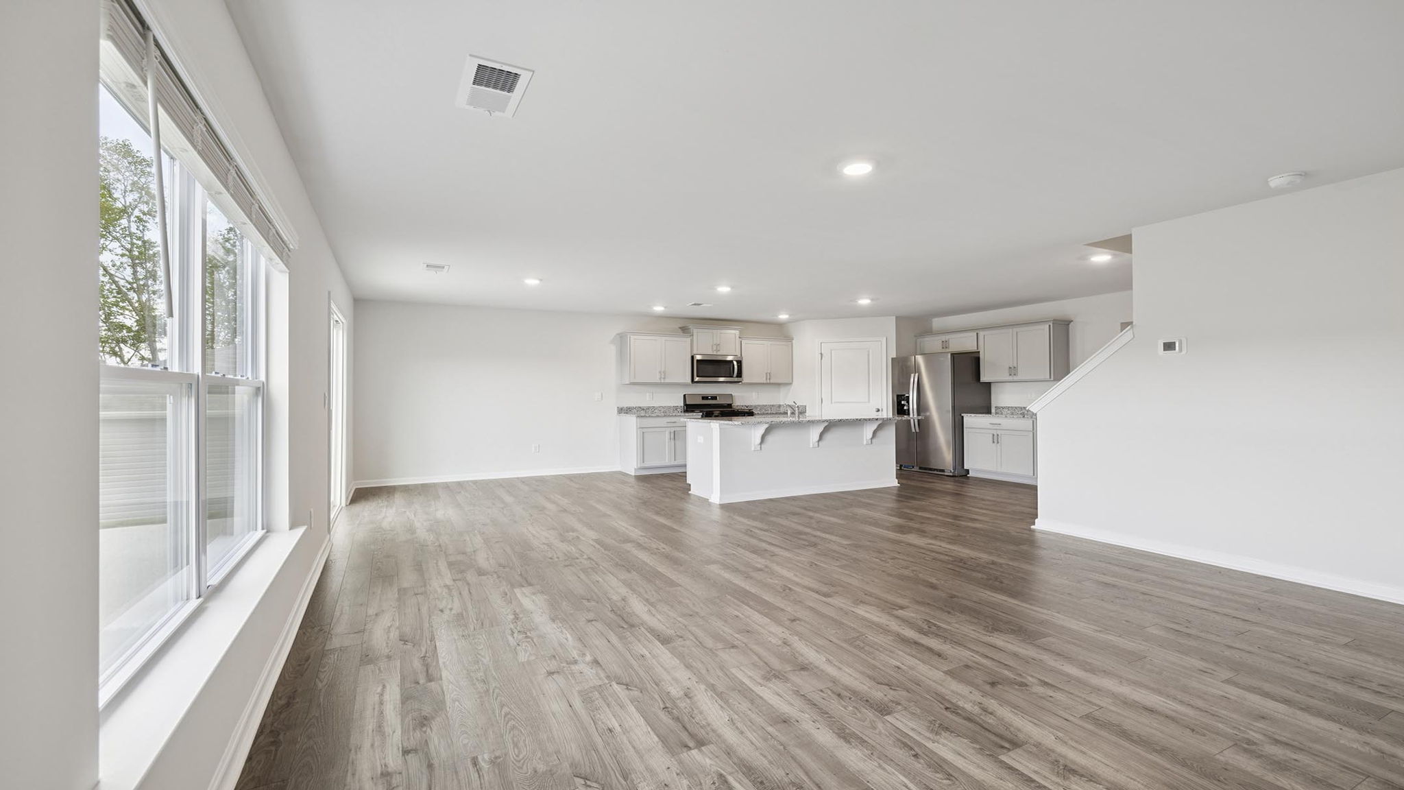 Kitchen and island with granite counter tops.