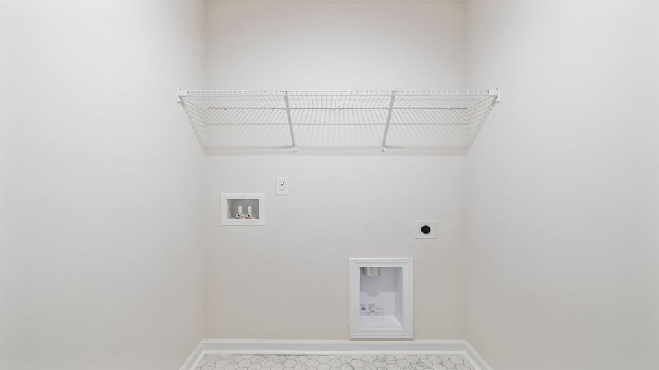 Walk in laundry with shelves.