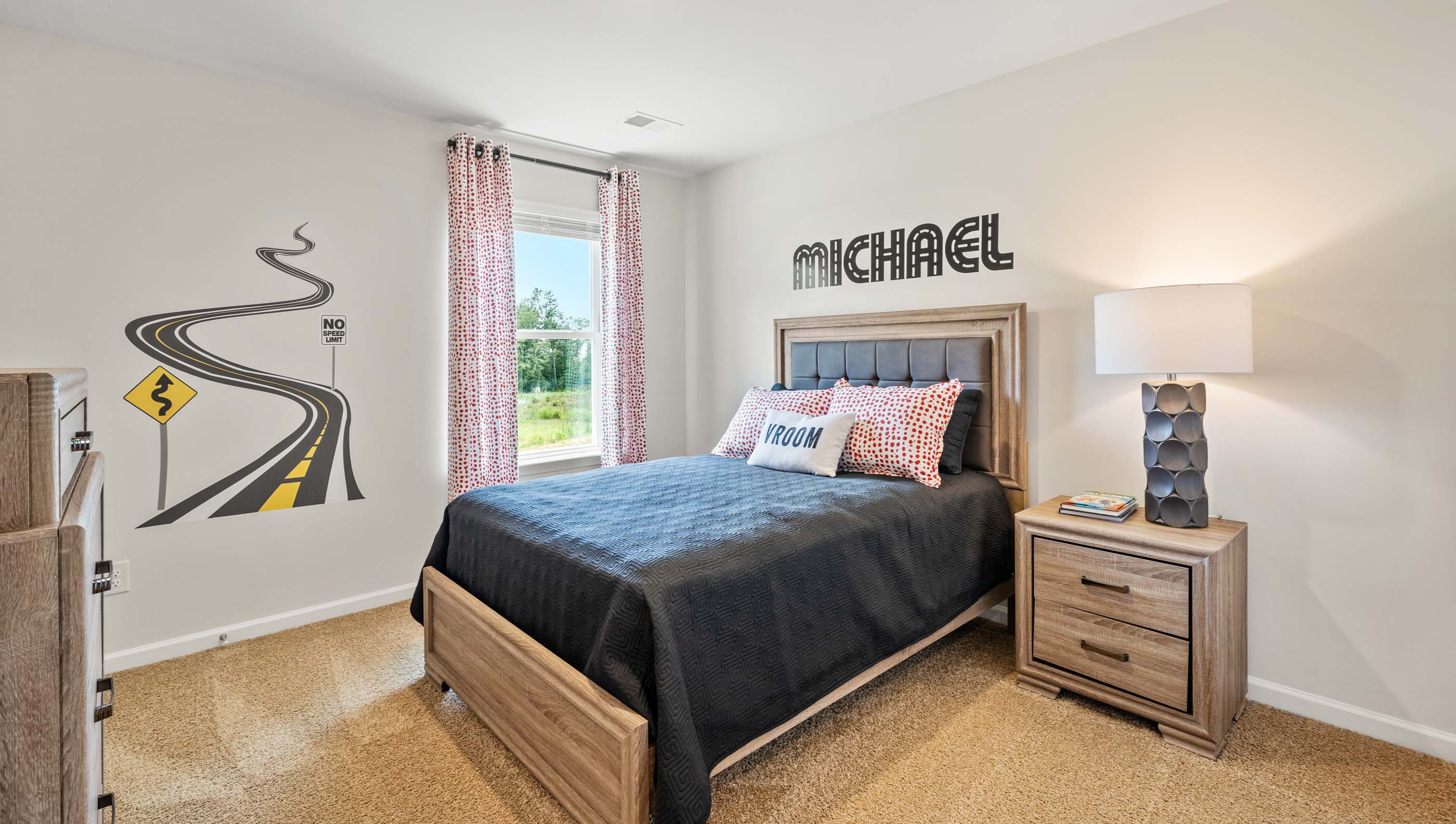 Bedroom with carpet floors and window.
