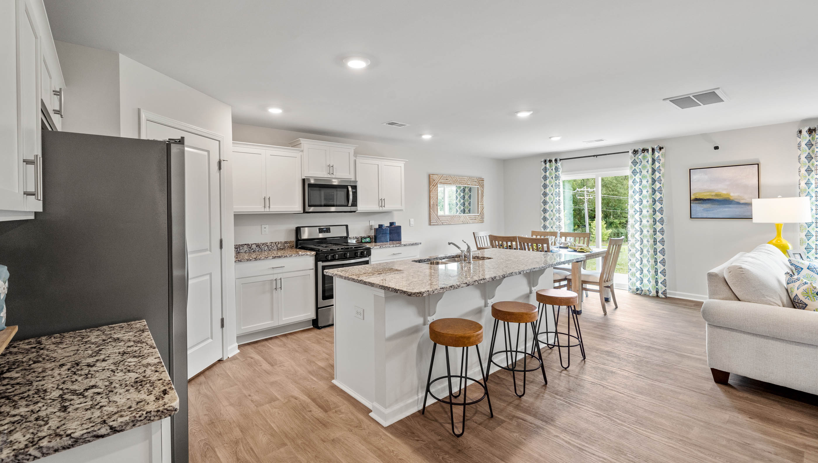 Kitchen and island with granite counter tops.