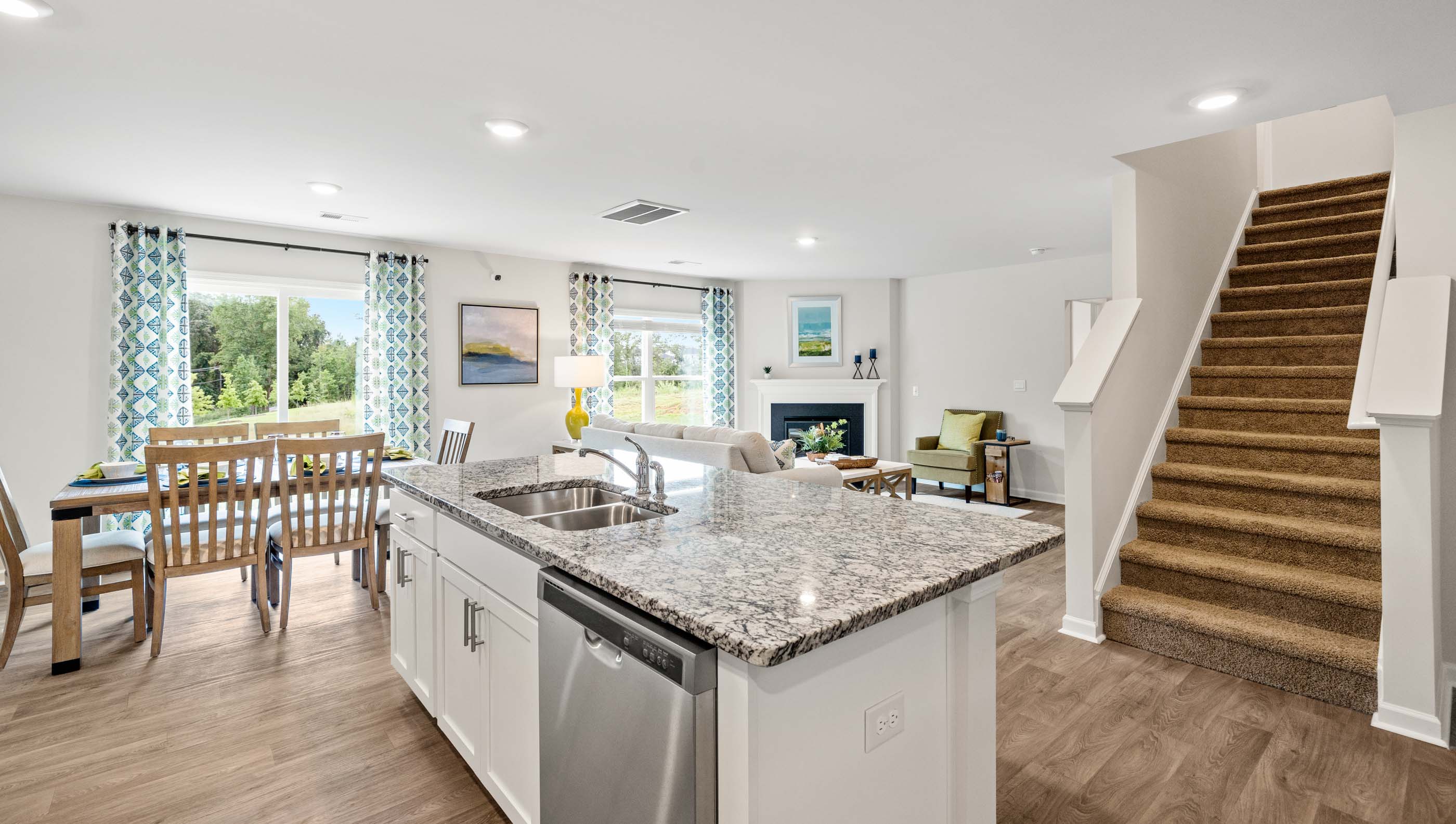 Kitchen and island with granite counter tops.