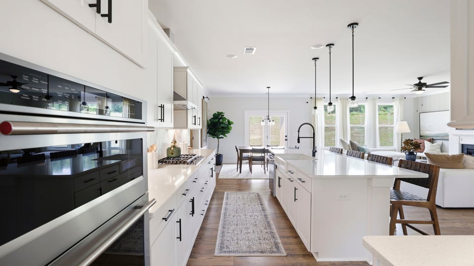 Kitchen with quartz countertops and stainless steel appliances.