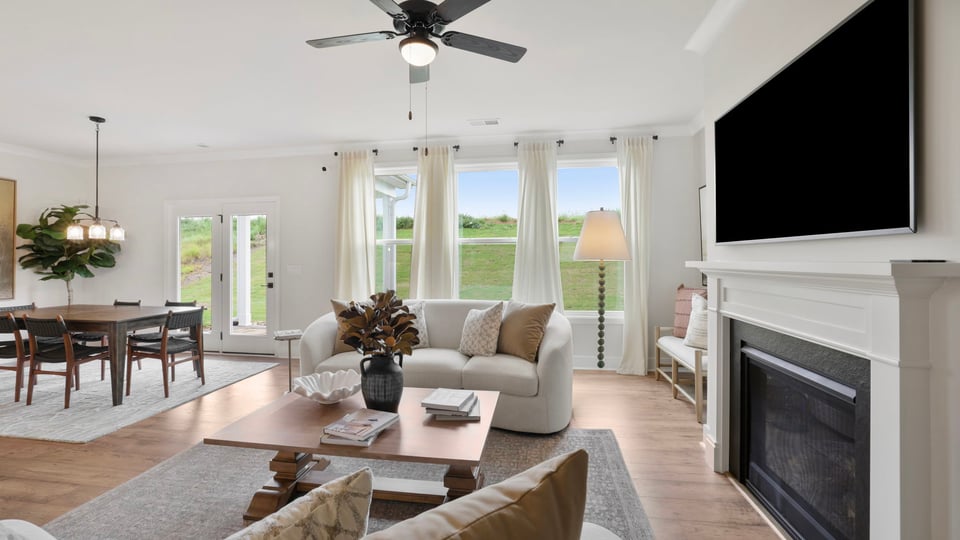 Livingroom with windows and fireplace.