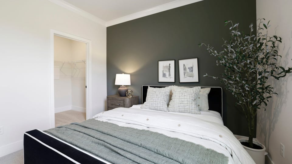 Bedroom with carpet and window.