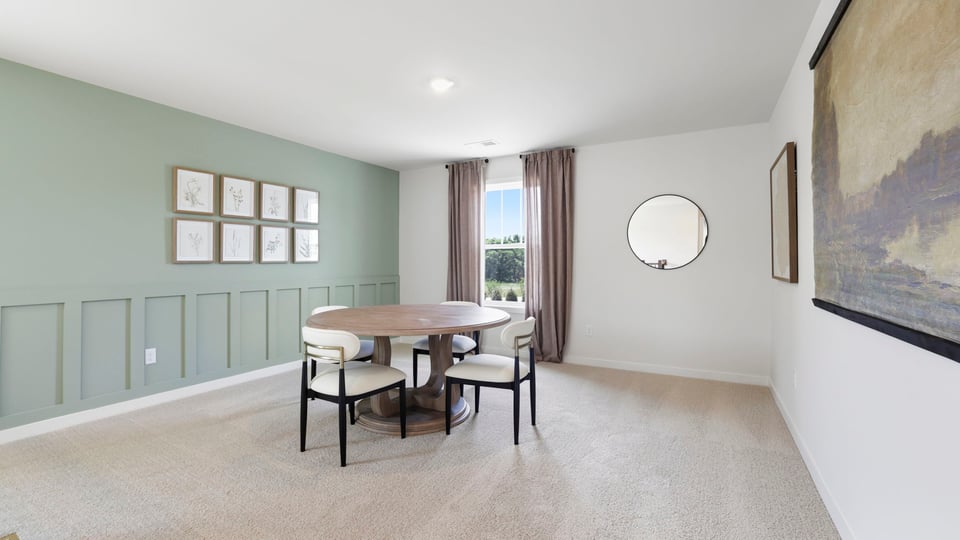 Loft area with carpet and window.