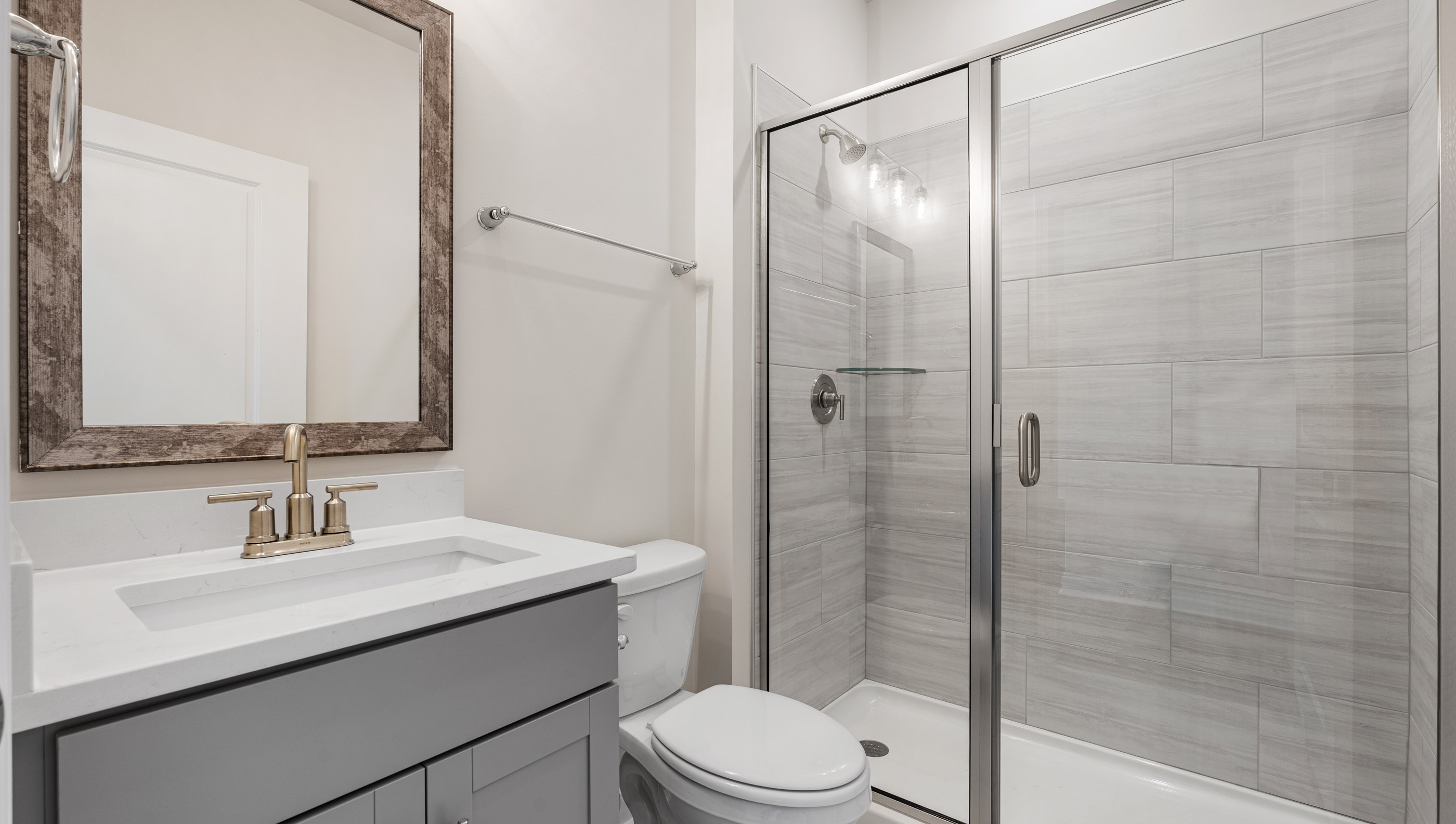 Bathroom with shower and vanity.