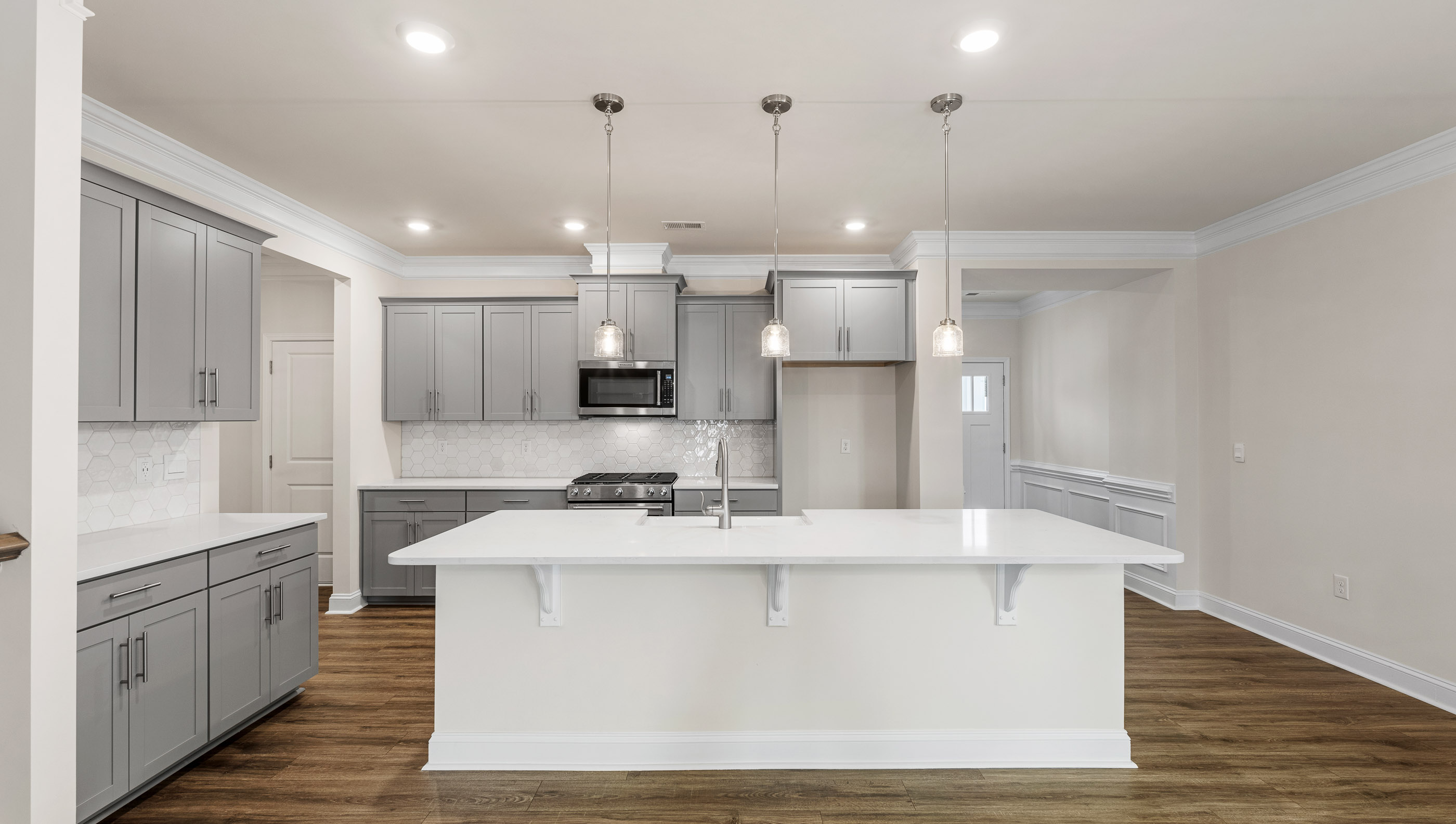 Kitchen with island and countertops.