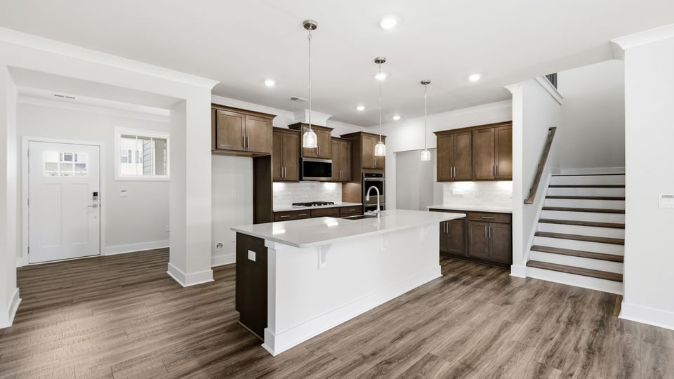 Kitchen with island and cabinets.
