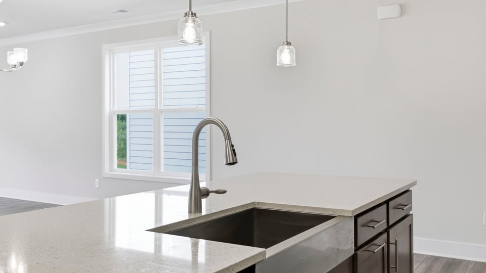 Kitchen with island and cabinets.