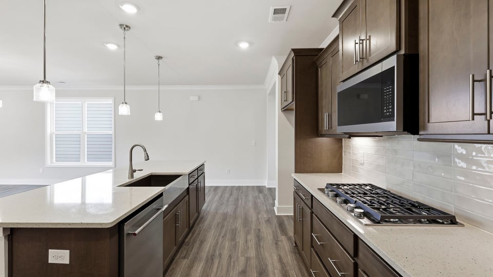 Kitchen with island and cabinets.