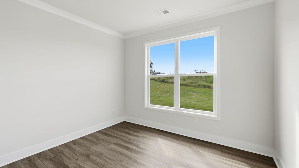Bedroom with window and closet.