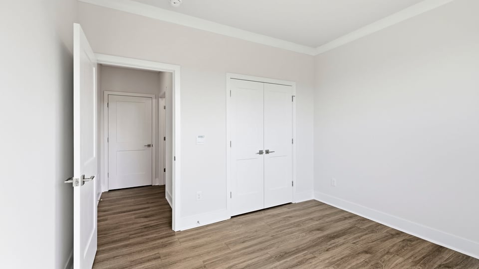 Bedroom with window and closet.
