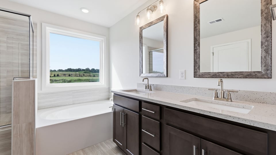 Primary bathroom with double vanity sinks.