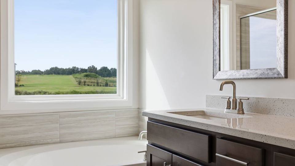 Primary bathroom with double vanity sinks.