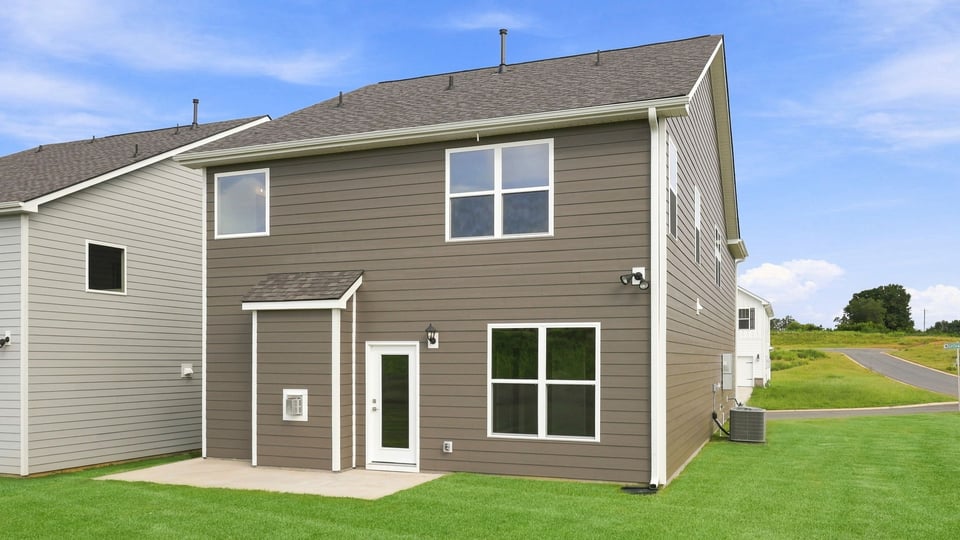 Back exterior with large backyard.