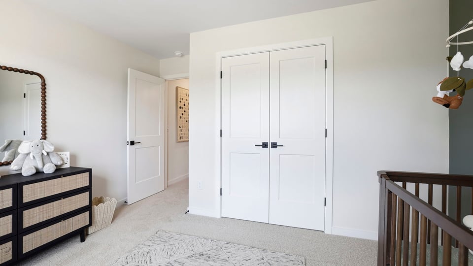 Bedroom with carpet and window.