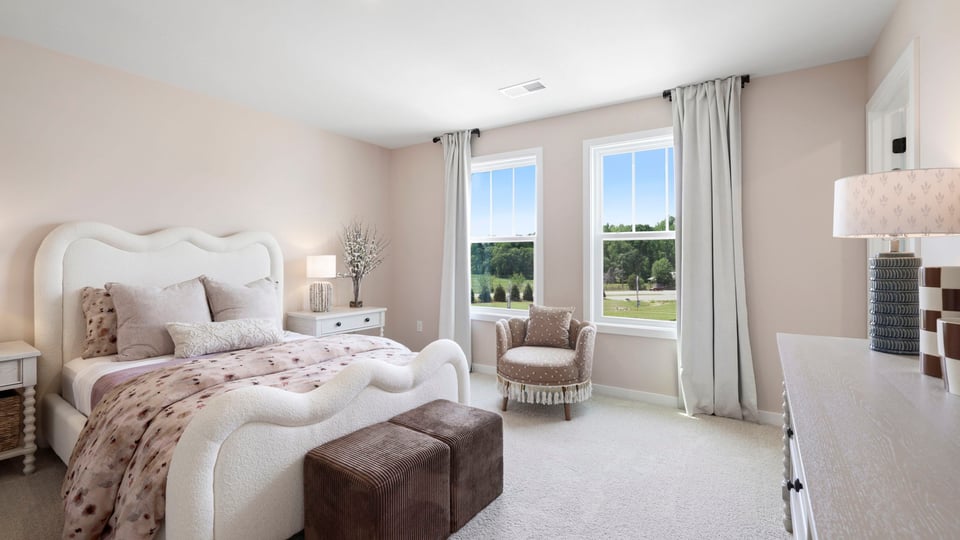 Bedroom with carpet and window.