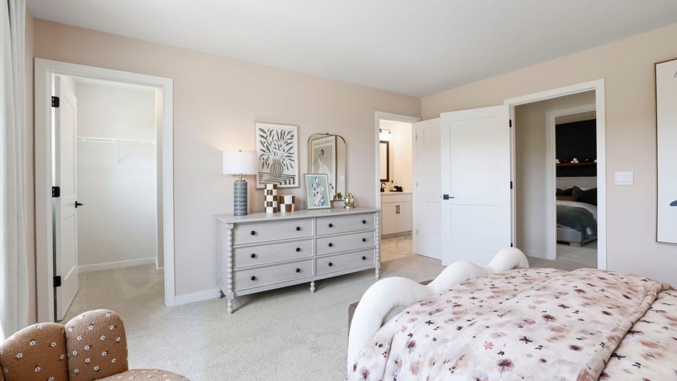 Bedroom with carpet and window.