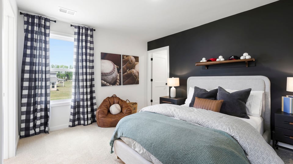 Bedroom with carpet and window.