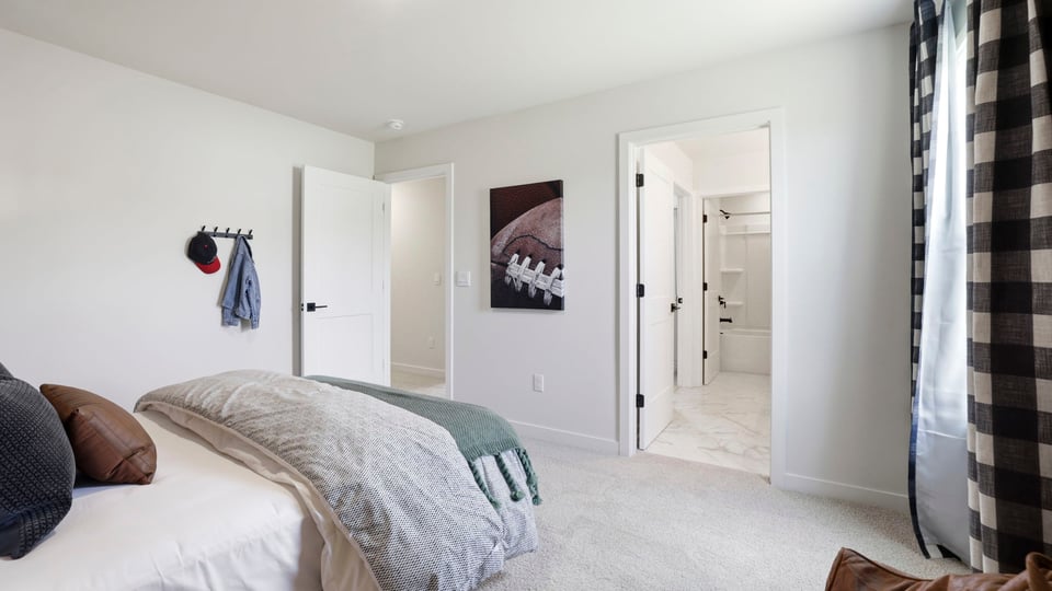 Bedroom with carpet and window.