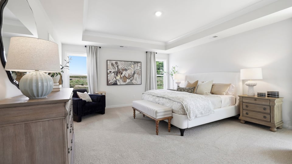 Bedroom with carpet and window.