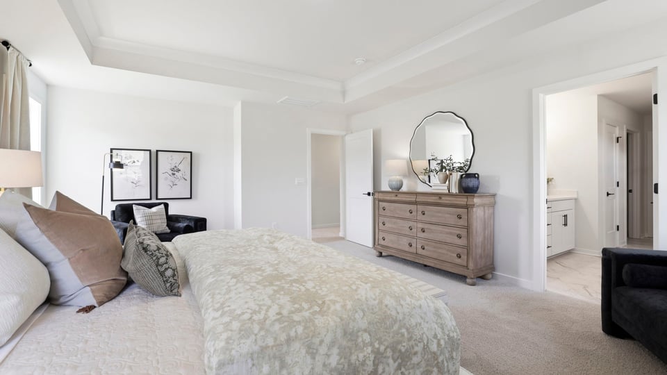 Bedroom with carpet and window.