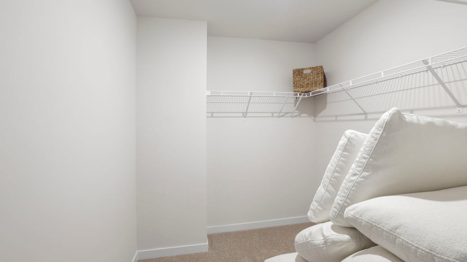 Closet with hanging storage racks.
