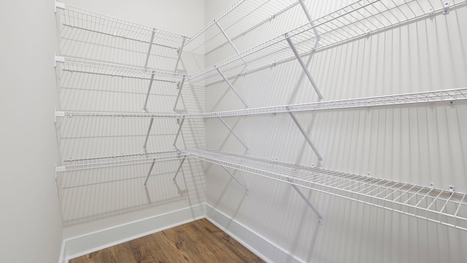 Closet with hanging storage racks.