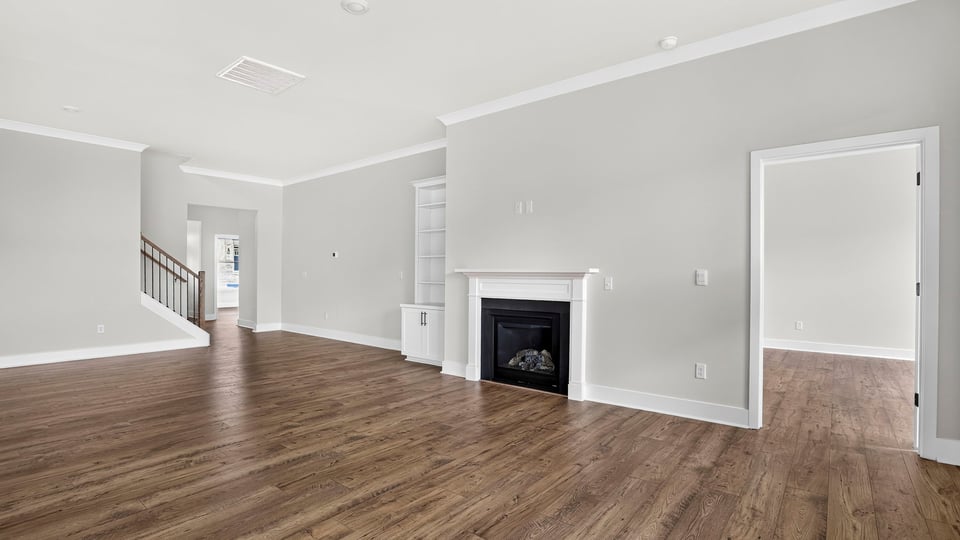 Family room with fireplae and window.