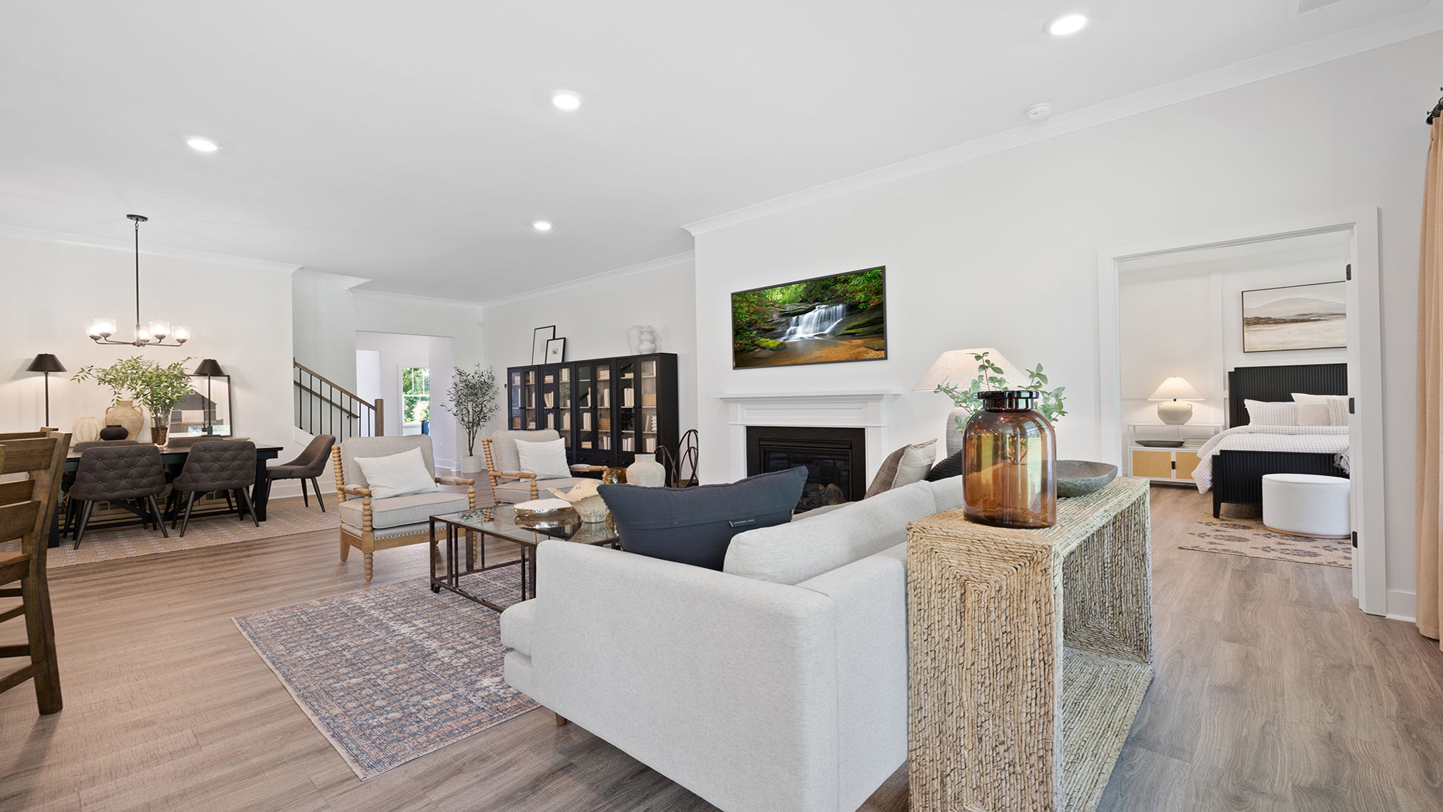 Kitchen and island with quartz countertops and stainless steel appliances.