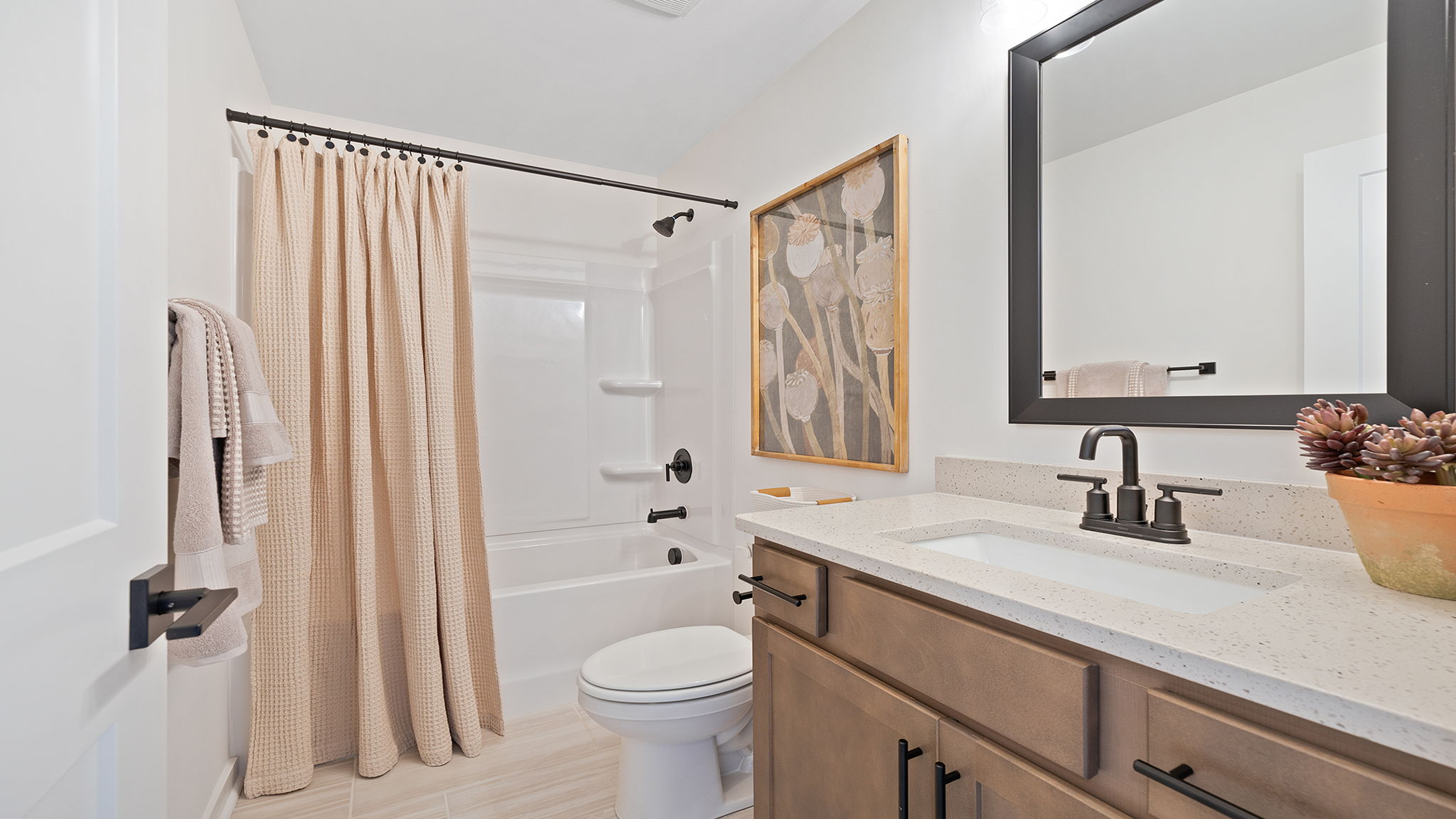 Bathroom with sink and shower.