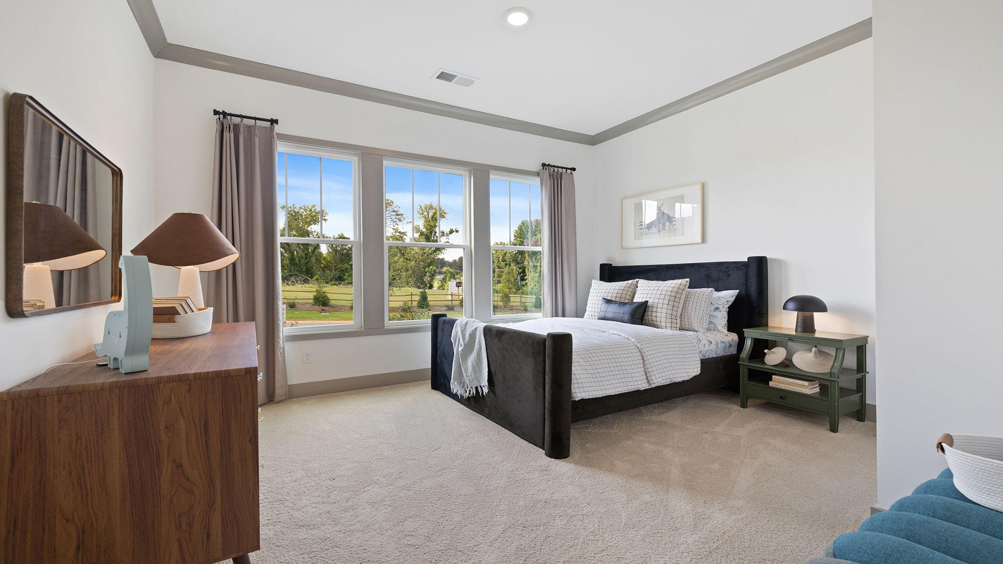 Bedroom with carpet and window.