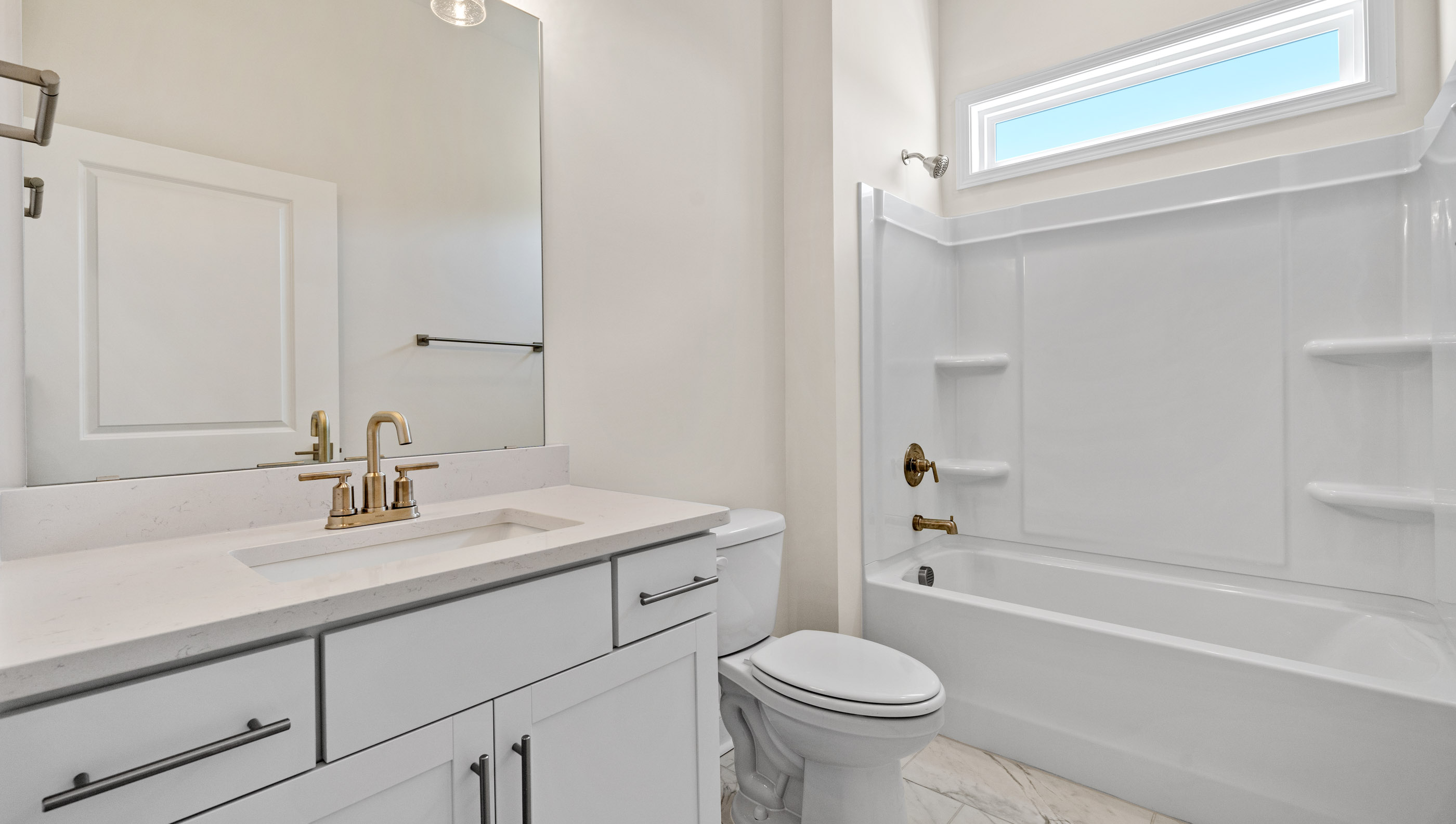 Bathroom with vanity and tubs.