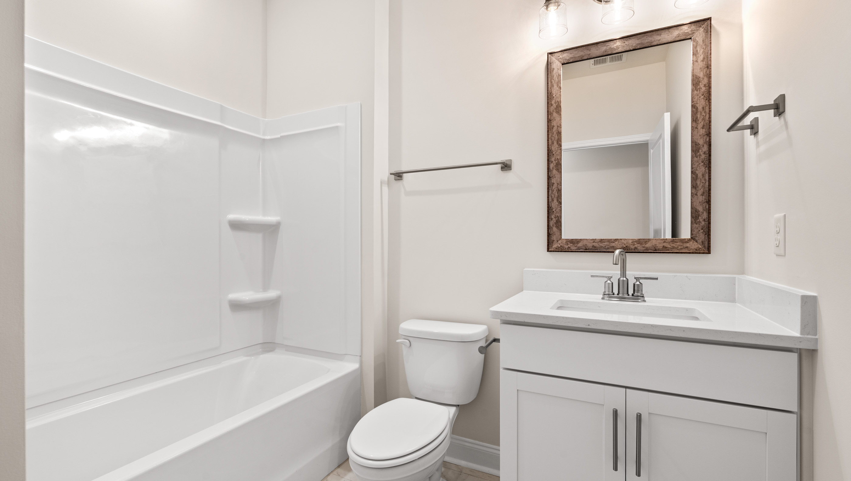Bathroom with vanity and tub.
