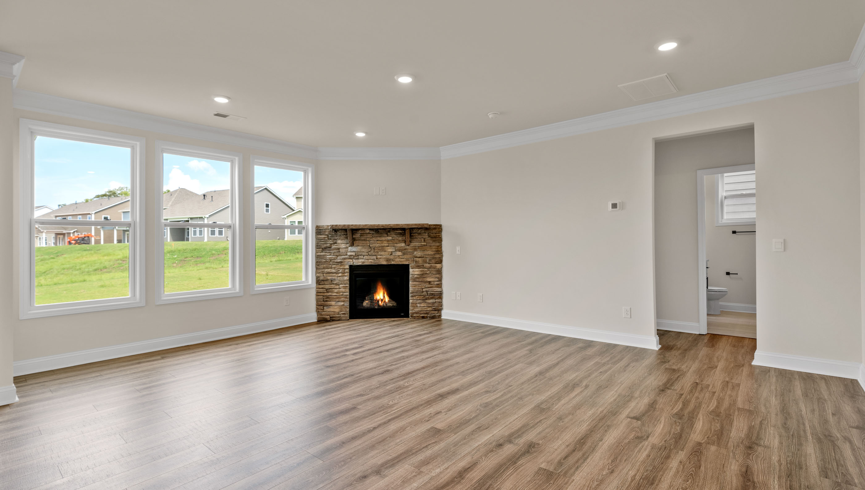 Livingroom with firplace and windows.