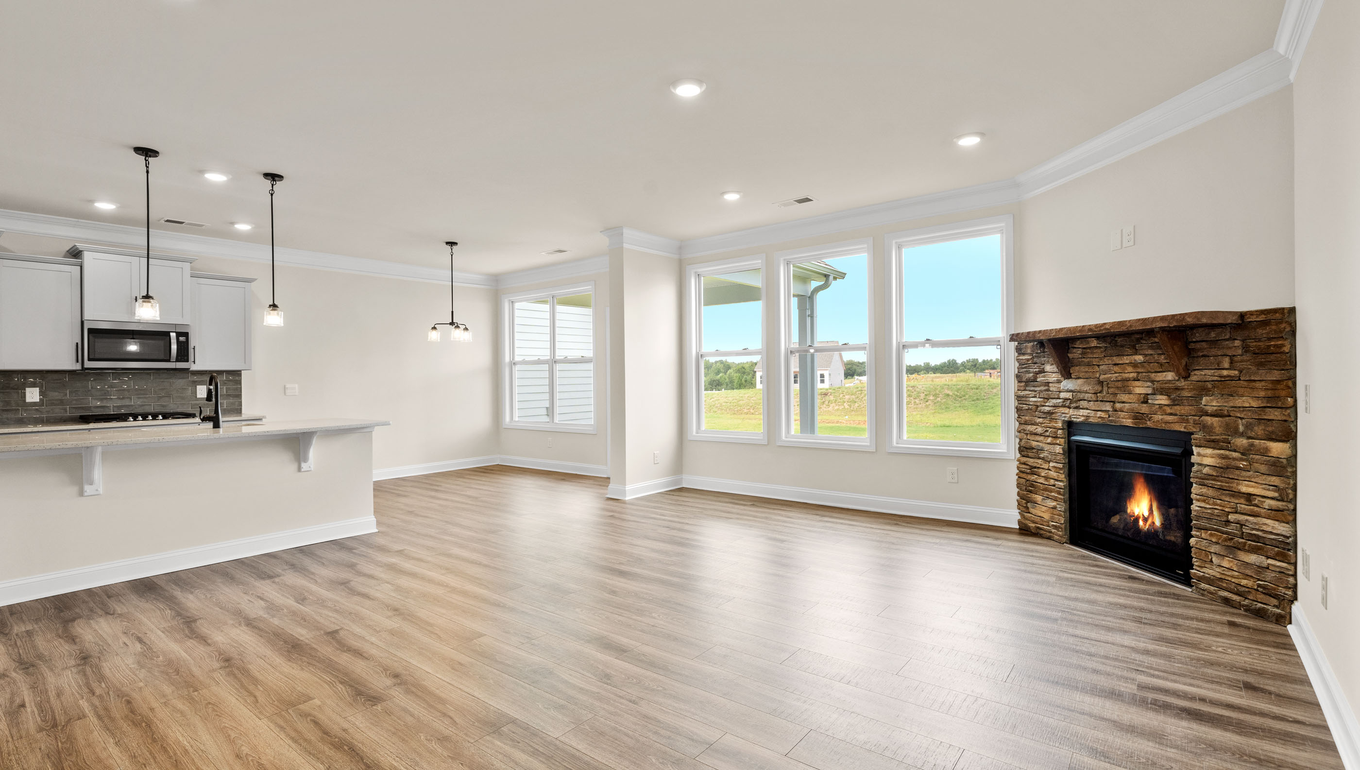 Livingroom with firplace and windows.