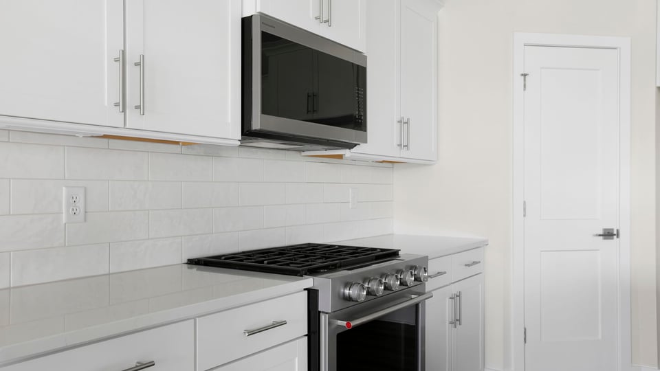 Kitchen with stainless steel appliances.
