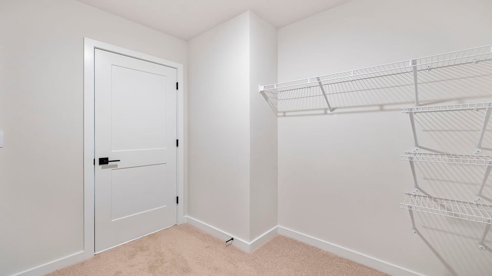 Large walk-in closet with shelves.