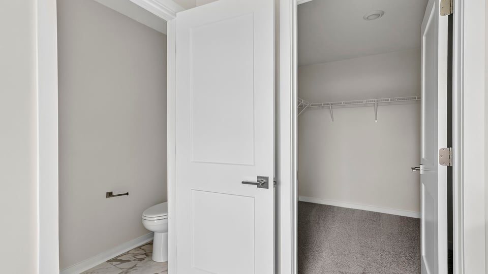 Closet with carpet.