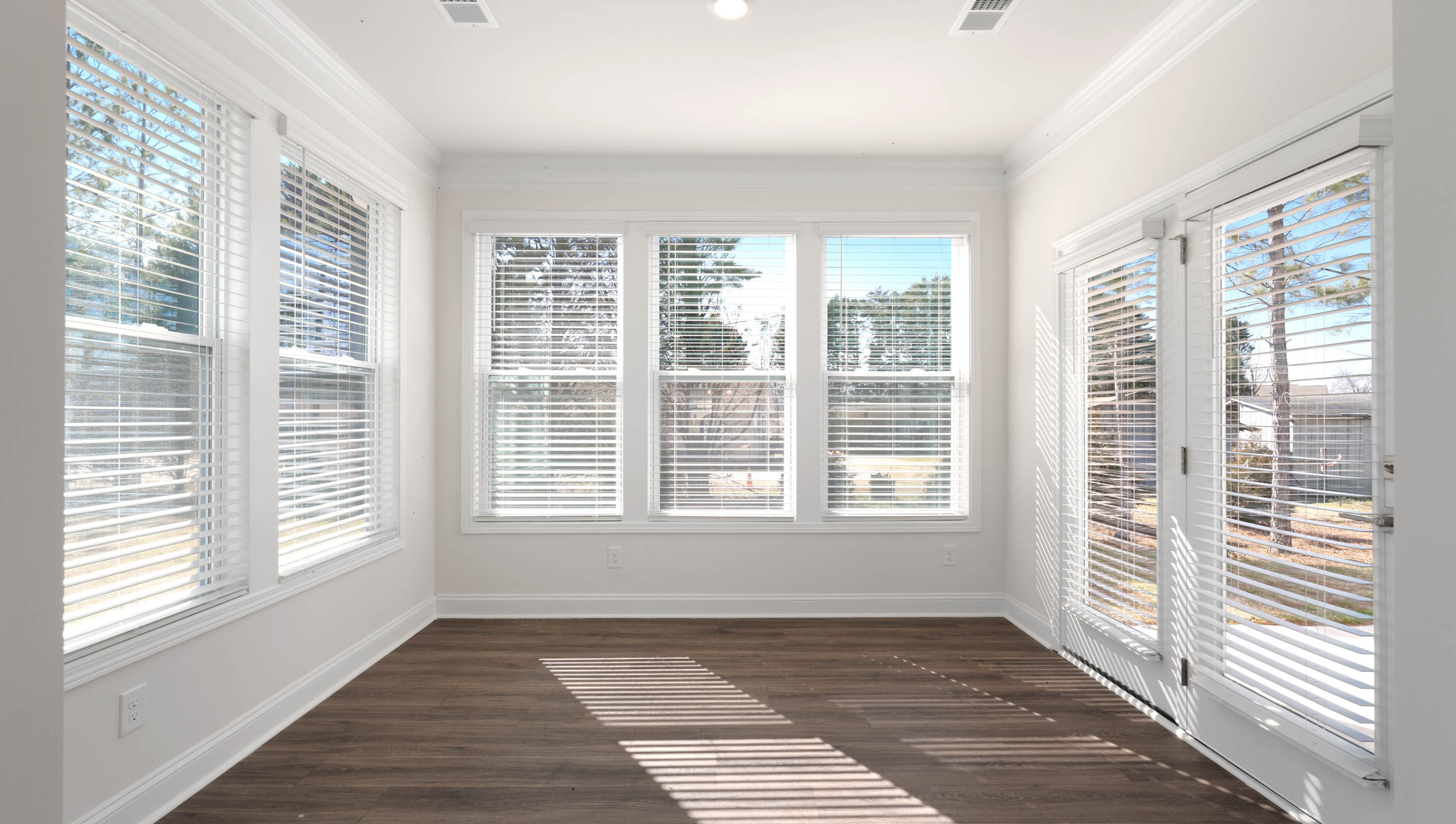View of sunroom with lots of windows and natural light.