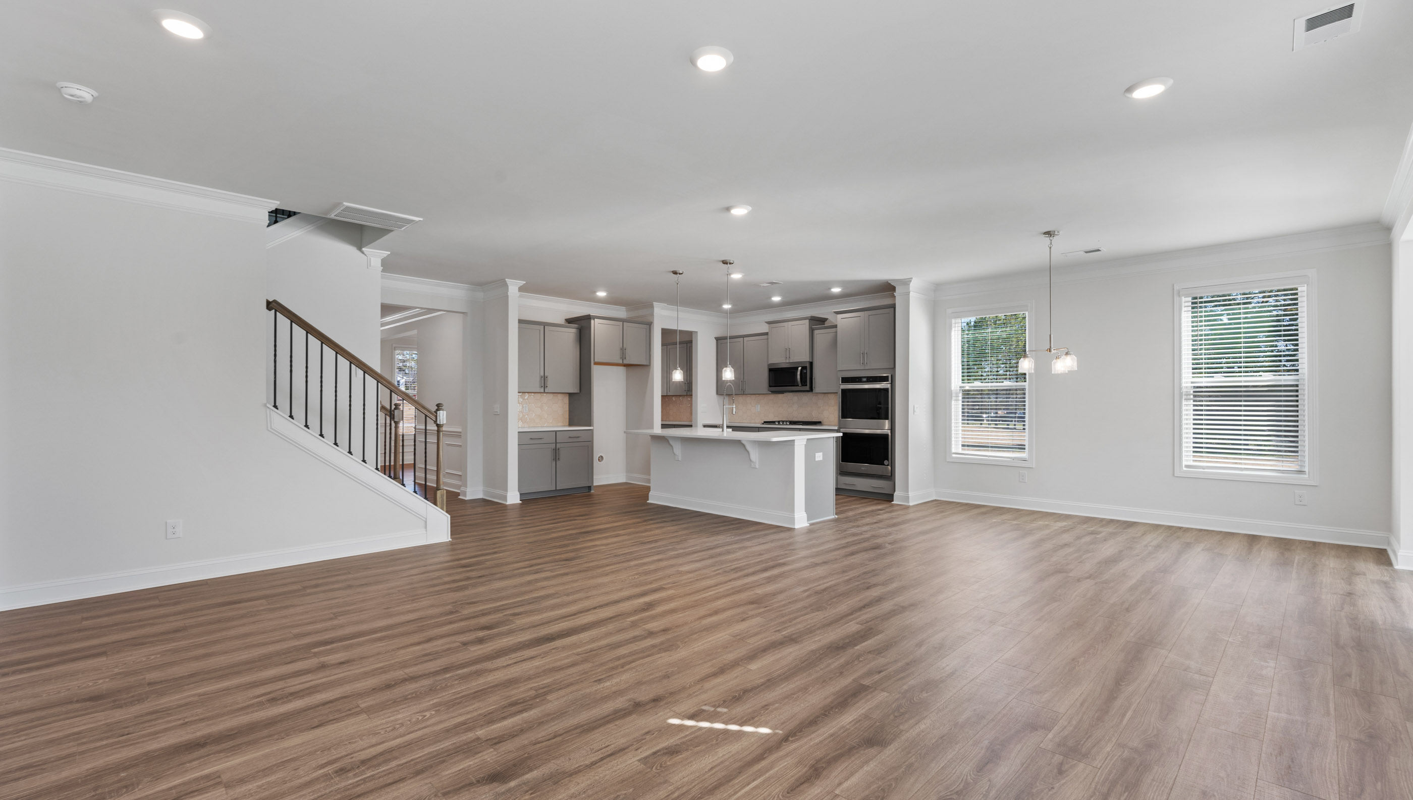 View of great room and stairwell to the second level of the home