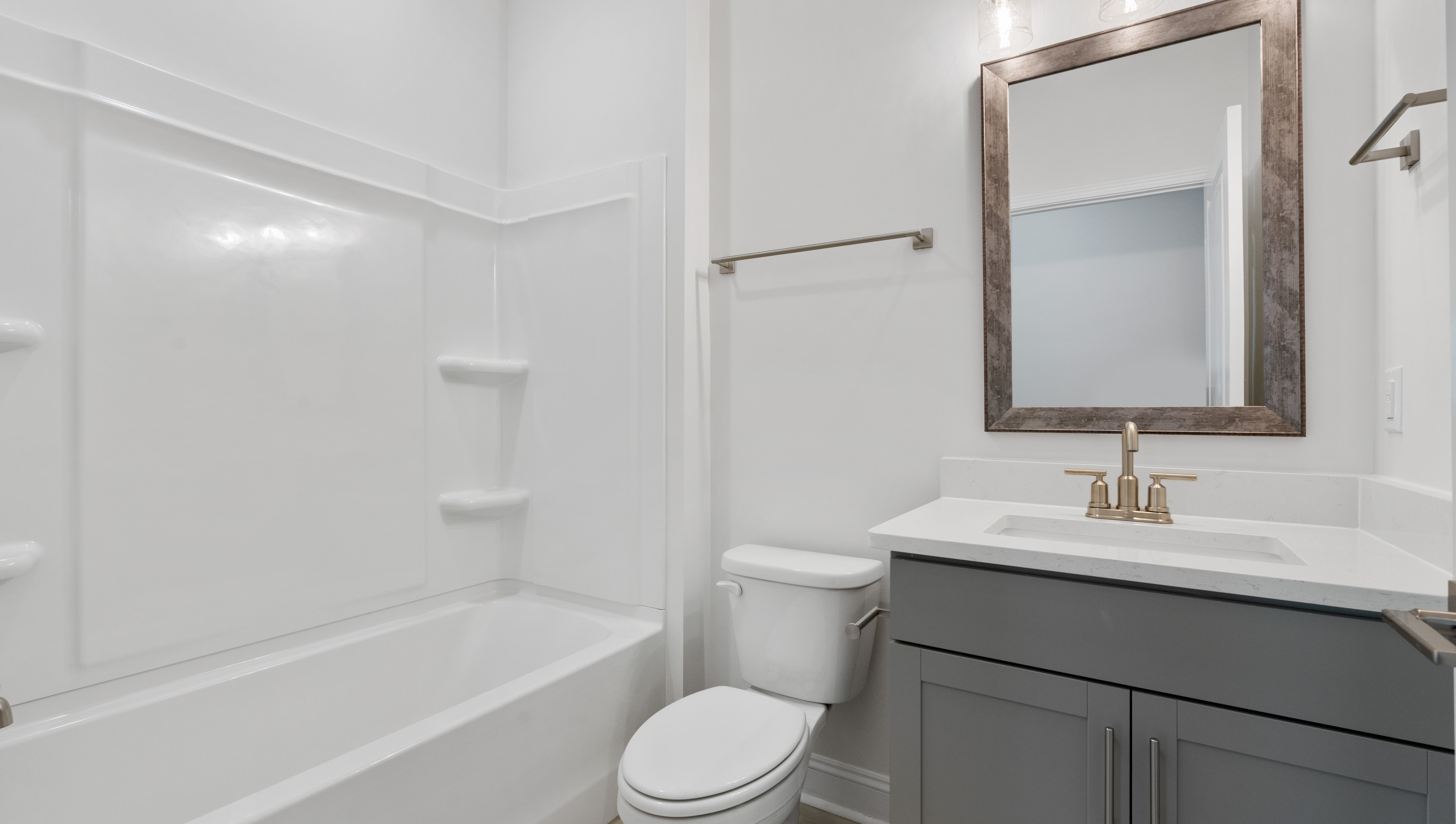 Main floor bathroom with combination tub / shower.